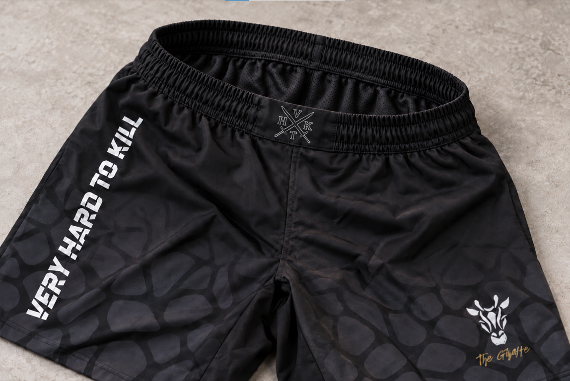 Close-up of VHTK All Black Giraffe shorts showing the elastic waistband.