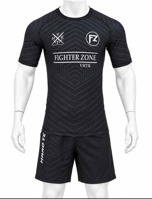 White mannequin wearing a black VHTK Fighter Zone rash guard and matching grappling shorts with geometric artwork.