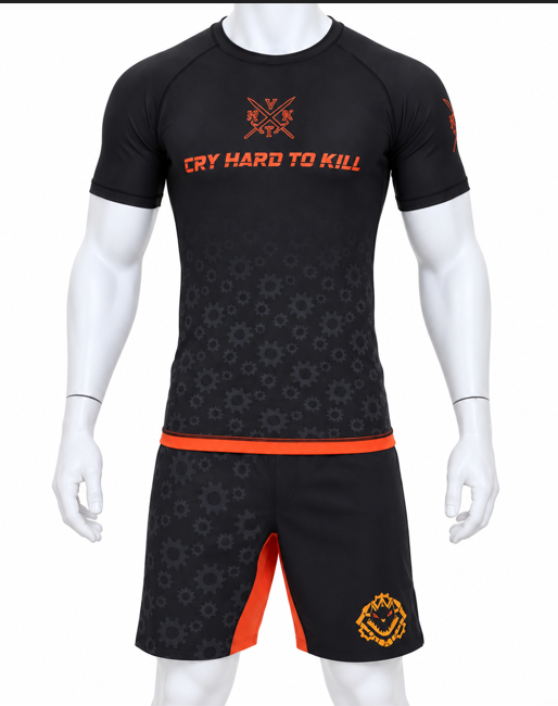 1. White mannequin wearing a black and orange VHTK rash guard and matching grappling shorts with gear-pattern artwork.